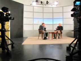 Jim Irwin (right) and Gergory Howell (left) sit and talk while waiting for the webcast to begin shooting.